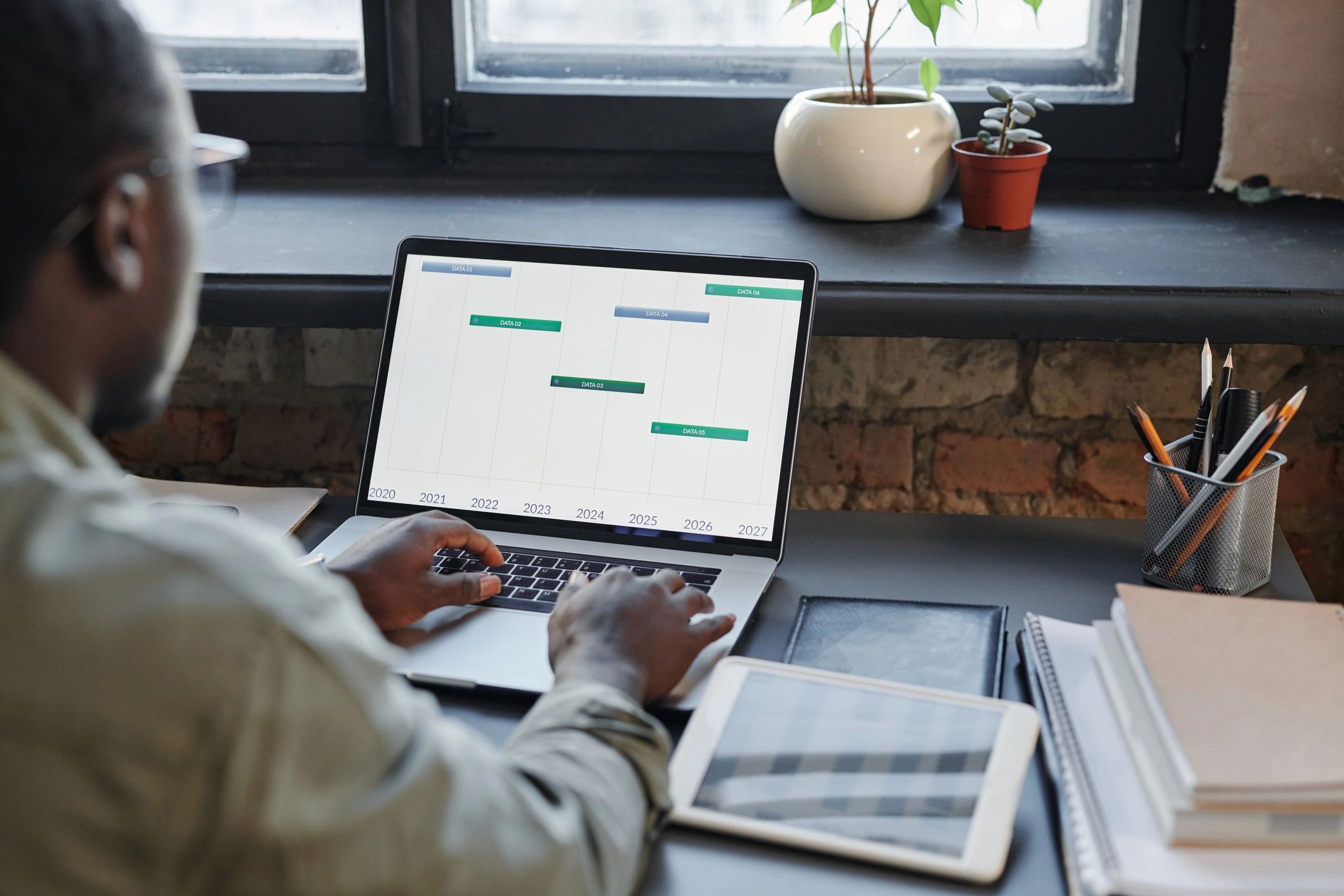 Finance analyst working with data on laptop