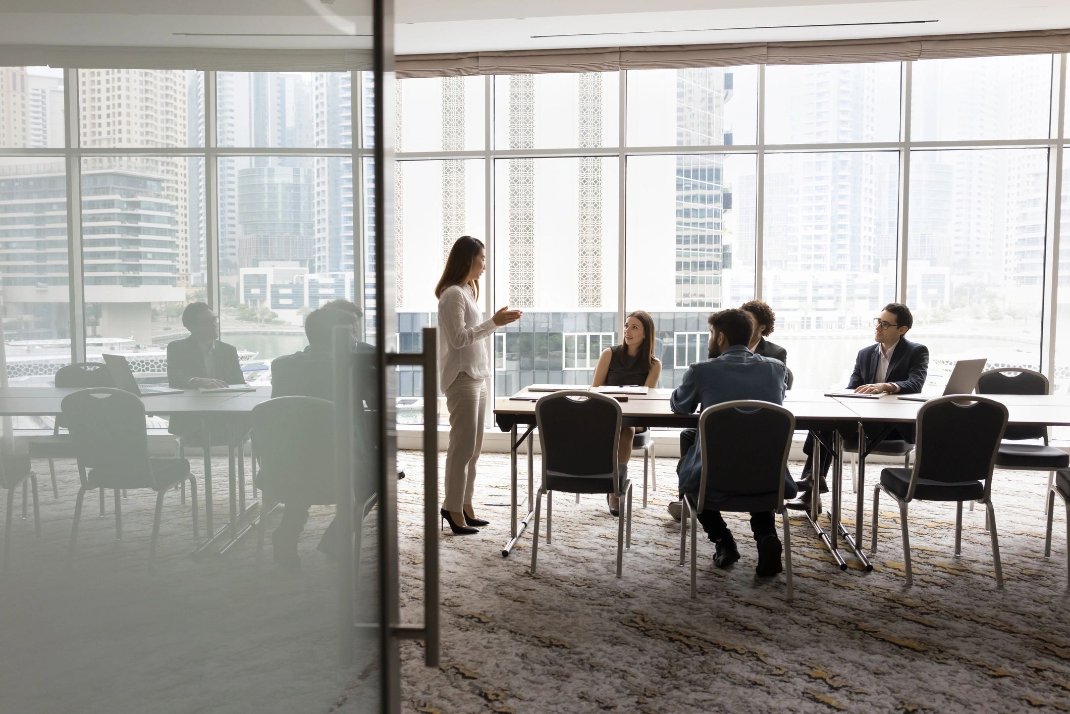 Multiethnic business team talking at meeting table