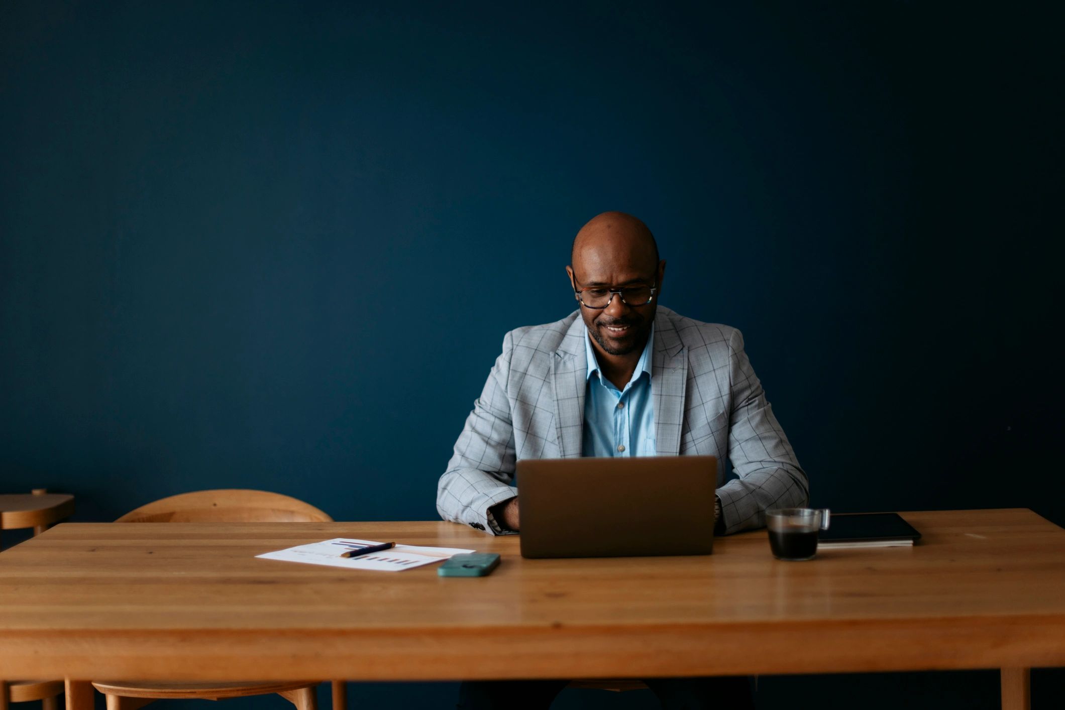 Businessman working on laptop at office desk